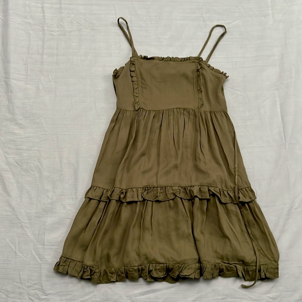 Army green sun dress with adjustable spaghetti straps and flared bottom.